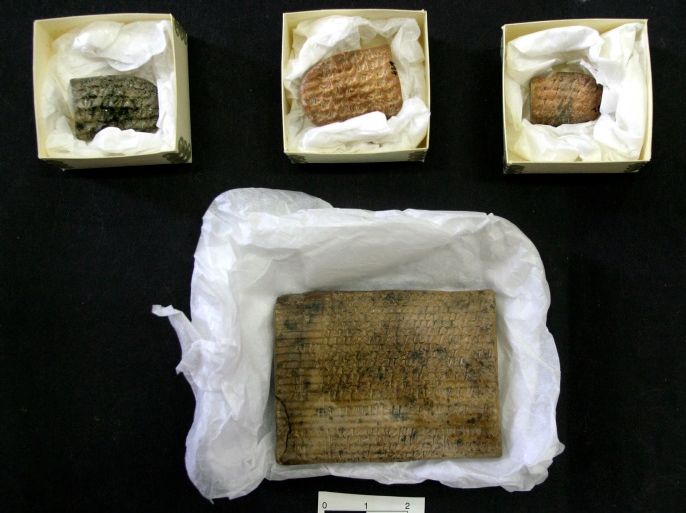 Achaemenian clay tablets written in cuneiform, are shown at Iran's National Museum in Tehran May 2, 2004. A set of 2,500-year-old clay tablets depicting life in ancient Persia were returned to Iran by [U.S. archaeologists from the University of Chicago over sixty years after they was borrowed in 1939.]