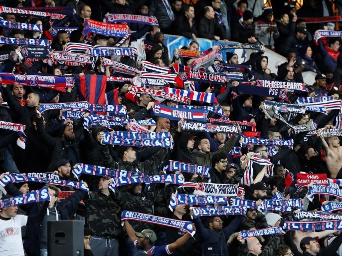 Soccer Football - Coupe de France - Paris St Germain vs Guingamp - Parc des Princes, Paris, France - January 24, 2018 Paris Saint-Germain fans hold up scarves REUTERS/Gonzalo Fuentes