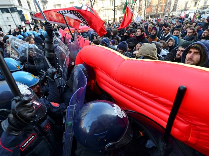 Demonstrators scuffle with police during an anti-fascism demonstration in Milan, Italy, February 24, 2018. REUTERS/Massimo Pinca