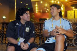 Former Argentine soccer star Diego Maradona talks to Argentina's striker Sergio Aguero at the squad's hotel at the Beijing 2008 Olympic Games, August 20, 2008. REUTERS/Stringer (CHINA)
