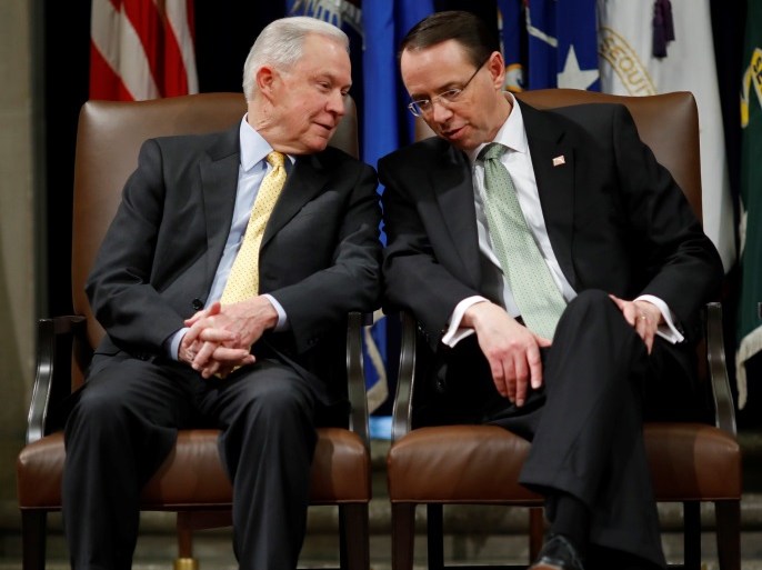 United States Attorney General Jeff Sessions speaks with Deputy Attorney General Rod Rosenstein at a summit about combating human trafficking at the Department of Justice in Washington, U.S., February 2, 2018. REUTERS/Aaron P. Bernstein