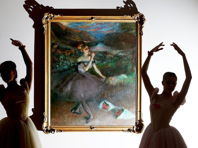 MELBOURNE, AUSTRALIA - JUNE 23: Ballerinas from The Australian Ballet are silhouetted as they pose next to one of Edgar Degas iconic ballet dancer paintings 'Dancer with Bouquets' during the media preview for the 'Degas: A New Vision' exhibition at National Gallery of Victoria on June 23, 2016 in Melbourne, Australia. The exhibition will run 24 June to 18 September as part of the Melbourne Winter Masterpieces series. (Photo by Scott Barbour/Getty Images)