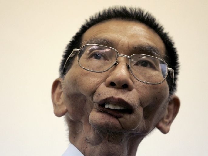 Tsai Lin-jang, who lost his jaw due to oral cancer, listens to a question during an interview with Reuters in Taoyuan July 3, 2007. Tsai, 60, had eaten betel nuts for 25 years, till he developed the cancer. He has since quit eating them after losing his jaw. For centuries, hundreds of millions of people across Asia, from Pakistan to Palau, have chewed the spicy date-like fruit of the betel palm for a quick buzz. Then four years ago, a World Health Organisation study found that chewing betel nuts can cause oral cancer and that the rate of these malignant mouth tumours was highest in Asia where the betel nut is a widely used stimulant. To match feature TAIWAN-BETELNUT/ REUTERS/Pichi Chuang (TAIWAN)