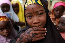 A girl displays traditional paintings on her hand in front of a local Koranic school on the second day of the holy month of Ramadan in Nigeria's northern city of Kano July 21, 2012. REUTERS/Akintunde Akinleye (NIGERIA - Tags: RELIGION SOCIETY)