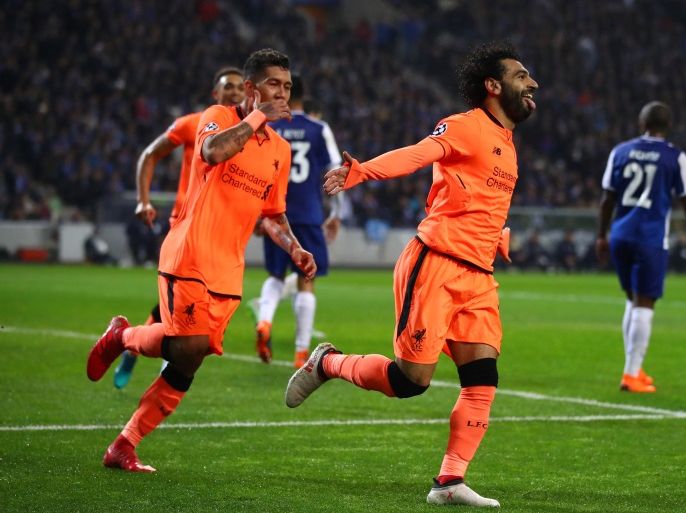 PORTO, PORTUGAL - FEBRUARY 14: Mohamed Salah of Liverpool celebrates scoring the 2nd goal with Roberto Firmino of Liverpool during the UEFA Champions League Round of 16 First Leg match between FC Porto and Liverpool at Estadio do Dragao on February 14, 2018 in Porto, Portugal. (Photo by Julian Finney/Getty Images)