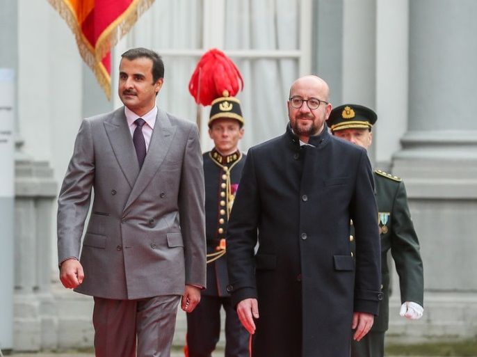 epa06584049 Sheikh Tamim Bin Hamad Al-Thani, Emir of State of Qatar (L) is welcomed by Belgian Prime Minister Charles Michel (R) prior to a meeting at the Egmont Palace in Brussels, Belgium, 6 March 2018. EPA-EFE/STEPHANIE LECOCQ