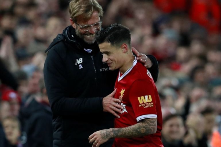 Soccer Football - Premier League - Liverpool vs Southampton - Anfield, Liverpool, Britain - November 18, 2017 Liverpool's Philippe Coutinho celebrates with manager Juergen Klopp after scoring their third goal Action Images via Reuters/Jason Cairnduff EDITORIAL USE ONLY. No use with unauthorized audio, video, data, fixture lists, club/league logos or