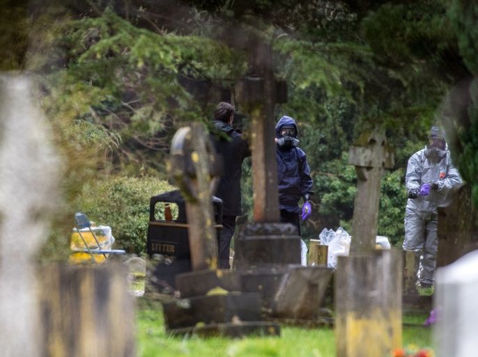 SALISBURY, ENGLAND - MARCH 10: Police officers remove protective suits after working in a police tent in London Road cemetery as they continue investigations into the poisoning of Sergei Skripal who was found critically ill on a bench in Salisbury with his daughter sparking a major incident on March 10, 2018 in Salisbury, England. Sergei Skripal who was granted refuge in the UK following a 'spy swap' between the US and Russia in 2010 and his daughter remain criticall