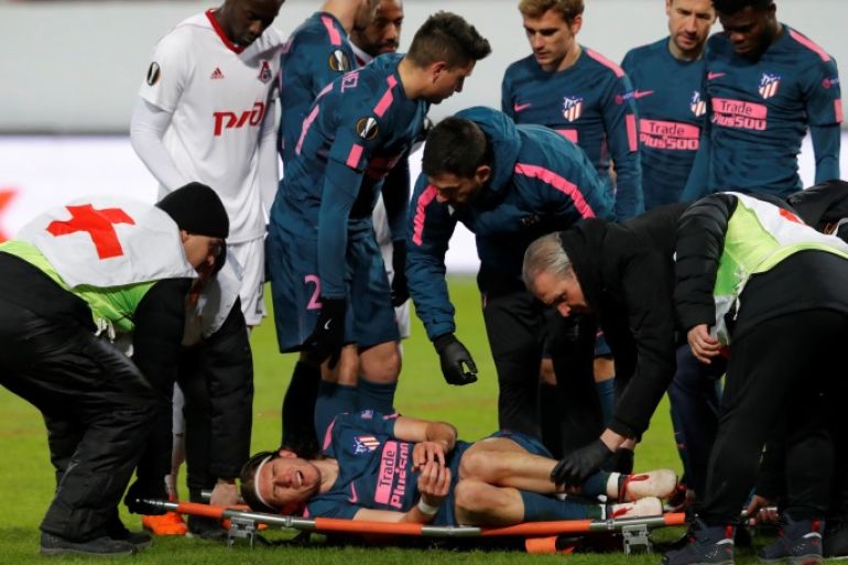 Soccer Football - Europa League Round of 16 Second Leg - Lokomotiv Moscow vs Atletico Madrid - RZD Arena, Moscow, Russia - March 15, 2018 Atletico Madrid's Filipe Luis is stretchered off after sustaining an injury REUTERS/Sergei Karpukhin