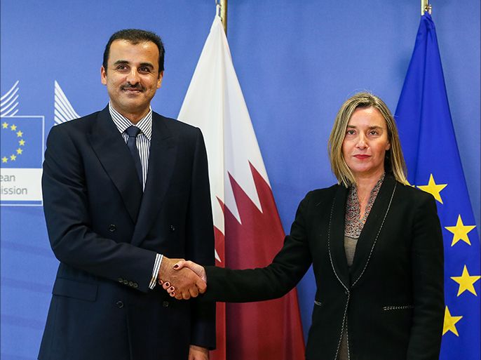 epa06586904 Emir of Qatar Sheikh Tamim Bin Hamad Al-Thani (L) is welcomed by EU High Representative for Foreign Affairs Federica Mogherini (L) prior to a meeting at the European Commission in Brussels, Belgium, 07 March 2018. EPA-EFE/STEPHANIE LECOCQ