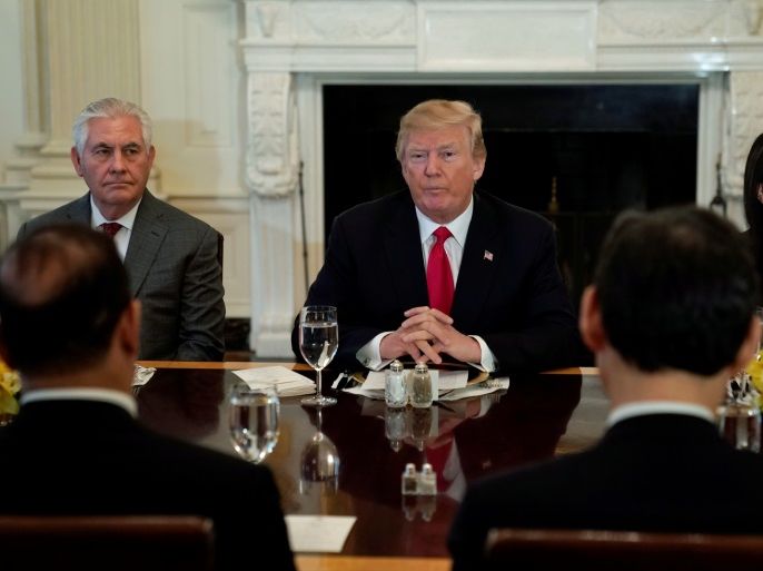 U.S. President Donald Trump, seated with Secretary of State Rex Tillerson and U.S. Ambassador to the United Nations Nikki Haley, plays host to a lunch for ambassadors to the United Nations Security Council at the White House in Washington, U.S. January 29, 2018. REUTERS/Jonathan Ernst