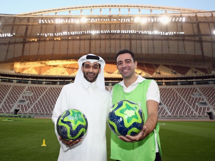 DOHA, QATAR - JANUARY 04: Hassan Al Thawadi, the Secretary General of the Qatar's Supreme Committee for Delivery and Legacy (SC) poses with former Spanish football professional and World Cup 2022 ambassador Xavi Hernandez during a presentation at the at Khalifa International Stadium on January 4, 2018 in Doha, Qatar. (Photo by Alex Grimm/Bongarts/Getty Images)