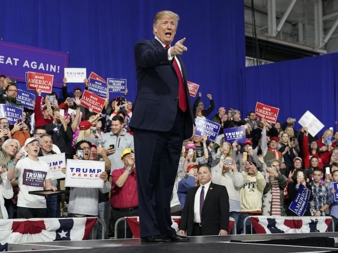 U.S. President Donald Trump points at supporters after speaking in support of Republican congressional candidate Rick Sacconne during a Make America Great Again rally in Moon Township, Pennsylvania, U.S., March 10, 2018. REUTERS/Joshua Roberts