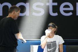 Tennis - Australian Open - Melbourne, Australia, January 14, 2018. Maria Sharapova of Russia has a drink during a practice session beside her coach Sven Groeneveld before the Australian Open tennis tournament. REUTERS/Issei Kato
