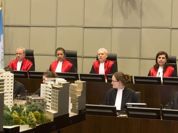 Judges (top row, L-R) Walid Akoum, Janet Nosworthy, David Re, Micheline Braidi and Nicola Lettier preside over the courtroom of the Special Tribunal for Lebanon in The Hague, The Netherlands, January 16, 2014. The trial in absentia of the four suspects accused of killing Lebanese statesman Rafiq al-Hariri opened in The Hague on Thursday, nine years after the bomb attack in which the former prime minister and 21 others died. REUTERS/Toussaint Kluiters/United Photos (NETHERLANDS - Tags: POLITICS CIVIL UNREST CRIME LAW)
