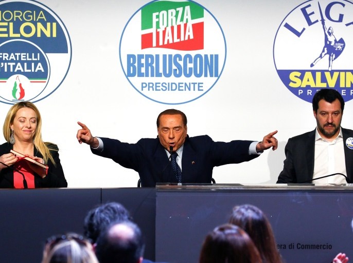 Forza Italia leader Silvio Berlusconi speaks flanked by Fratelli D'Italia party leader Giorgia Meloni and Northern League leader Matteo Salvini during a meeting in Rome, Italy, March 1, 2018. REUTERS/Alessandro Bianchi