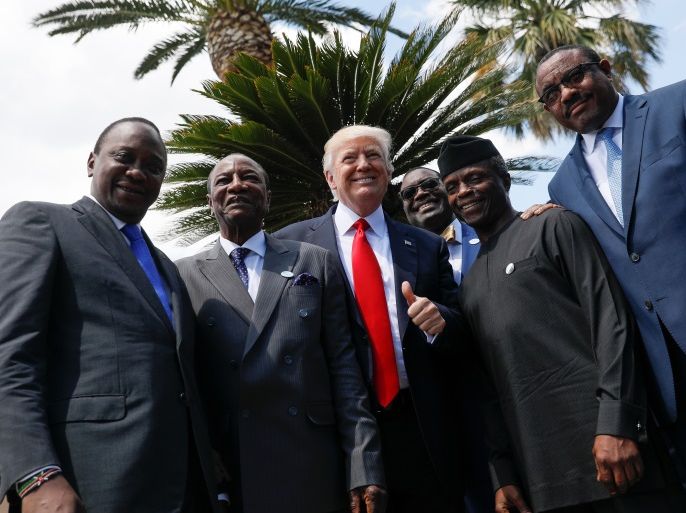 L-R: Kenya's President Uhuru Kenyatta, Guinea's President Alpha Conde, U.S. President Donald Trump, African Development Bank President Akinwumi Adesina, Nigeria's Vice-President Yemi Osinbajo and Ethiopia’s Prime Minister Hailemariam Desalegn pose following a family photo of the G7 Summit expanded session in Taormina, Sicily, Italy May 27, 2017. REUTERS/Jonathan Ernst TPX IMAGES OF THE DAY