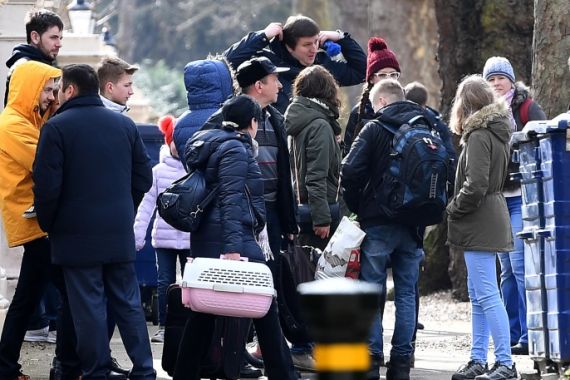 epa06615497 Russian diplomats and family members leave from the Russian Embassy in central London, Britain, 20 March 2018.