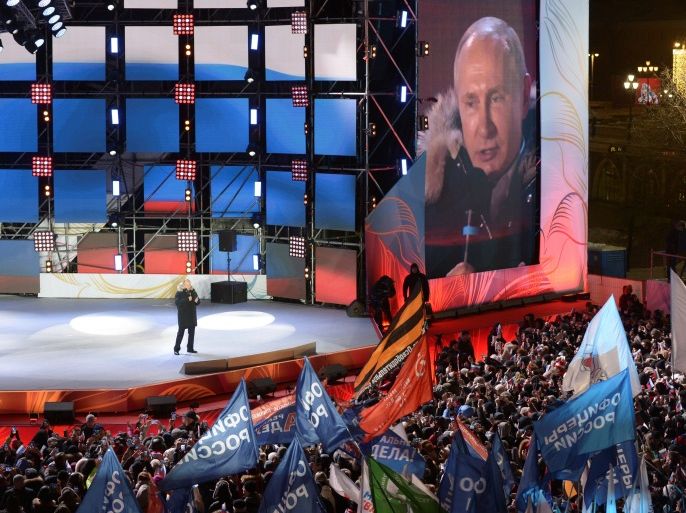 Russian President and Presidential candidate Vladimir Putin delivers a speech during a rally and concert marking the fourth anniversary of Russia's annexation of the Crimea region, at Manezhnaya Square in central Moscow, Russia March 18, 2018. Sputnik/Alexei Nikolsky/Kremlin via REUTERS ATTENTION EDITORS - THIS IMAGE WAS PROVIDED BY A THIRD PARTY.
