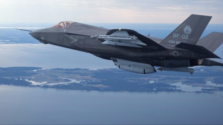 The U.S. Marine Corps version of Lockheed Martin's F35 Joint Strike Fighter, F-35B test aircraft BF-2 flies with external weapons for the first time over the Atlantic test range at Patuxent River Naval Air Systems Command in Maryland in a February 22, 2012 file photo. South Korea will not conduct maintenance of its new fleet of Lockheed Martin Corp F-35 fighters in Japan, a South Korean official said on December 18, 2014, despite a new deal by the Pentagon to service the stealth jets in Asia. REUTERS/Lockheed Martin/Handout (UNITED STATES - Tags: TRANSPORT MILITARY POLITICS) FOR EDITORIAL USE ONLY. NOT FOR SALE FOR MARKETING OR ADVERTISING CAMPAIGNS - RTR31UJE