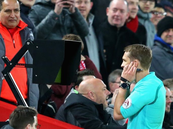 LIVERPOOL, ENGLAND - JANUARY 27: Craig Pawson, match referee, watches the VAR screen before awarding a penalty to Liverpool during The Emirates FA Cup Fourth Round match between Liverpool and West Bromwich Albion at Anfield on January 27, 2018 in Liverpool, England. (Photo by Alex Livesey/Getty Images)