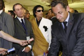 Libya's President Muammar Gaddafi (2ndR), French President Nicolas Sarkozy (R) and Claude Gueant (2ndL), General Secretary of the Elysee Palace, visit Bab Azizia Palace in Tripoli July 25, 2007 the day after the release of six foreign medics from Libyan jails. France has opened a judicial investigation into allegations that former President Nicolas Sarkozy's 2007 election bid won illicit funds from late Libyan leader Muammar Gaddafi, the public prosecutor's office s