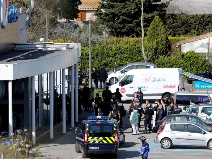 A general view shows gendarmes and police officers at a supermarket after a hostage situation in Trebes, France, March 23, 2018. REUTERS/Jean-Paul Pelissier TPX IMAGES OF THE DAY