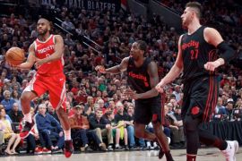 Mar 20, 2018; Portland, OR, USA; Houston Rockets guard Chris Paul (3) shoots over Portland Trail Blazers guard Shabazz Napier (6), forward Al-Farouq Aminu (8) and center Jusuf Nurkic (27) during the second quarter at the Moda Center. Mandatory Credit: Craig Mitchelldyer-USA TODAY Sports