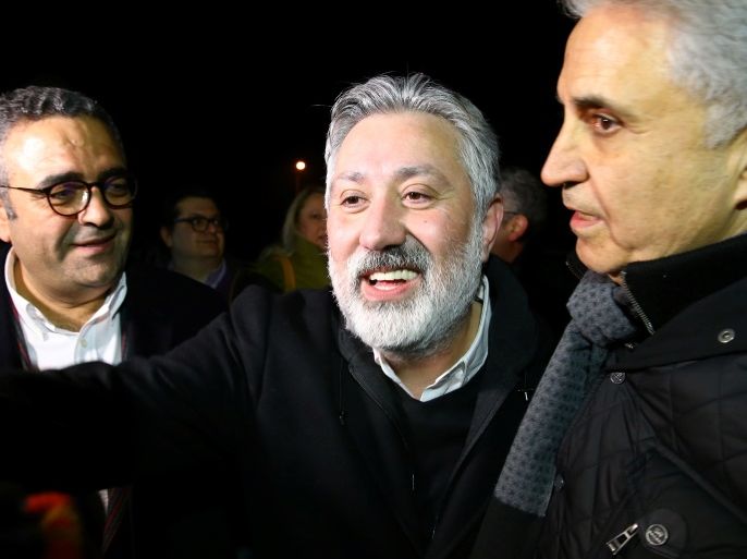 Murat Sabuncu, editor-in-chief of the newspaper Cumhuriyet, is greeted by his friends after being released from the prison in Silivri near Istanbul, Turkey March 10, 2018.ÊREUTERS/Huseyin Aldemir