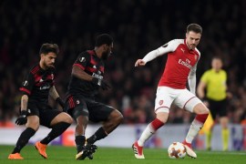 LONDON, ENGLAND - MARCH 15: Aaron Ramsey of Arsenal keeps the ball from Franck Kessie and Suso of AC Milan during the UEFA Europa League Round of 16 Second Leg match between Arsenal and AC Milan at Emirates Stadium on March 15, 2018 in London, England. (Photo by Shaun Botterill/Getty Images)