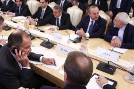 Foreign ministers, Sergei Lavrov (L, front) of Russia, Mevlut Cavusoglu (2nd R, back) of Turkey, Mohammad Javad Zarif (R, back) of Iran, and members of the delegations attend a meeting in Moscow, Russia, December 20, 2016. REUTERS/Maxim Shemetov