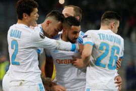 Soccer Football - Europa League Round of 16 First Leg - Olympique de Marseille vs Athletic Bilbao - Orange Velodrome, Marseille, France - March 8, 2018 Marseille's Lucas Ocampos celebrates scoring their third goal with Dimitri Payet and team mates REUTERS/Jean-Paul Pelissier