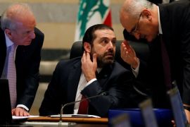 Finance Minister Ali Hassan Khalil gestures as he talks with Lebanon's Prime Minister Saad al-Hariri during a cabinet meeting at the governmental palace in Beirut, Lebanon March 12, 2018. REUTERS/Mohamed Azakir