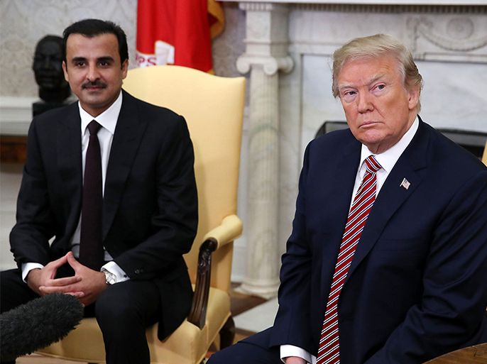 epa06659872 US President Donald J. Trump (R) speaks during a meeting with the Emir of Qatar Sheikh Tamim bin Hamad Al Thani (L), in the Oval Office at the White House, in Washington, DC, USA, 10 April 2018. President Trump has announced that he canceled his upcoming trip to the 8th annual Summit of the Americas in Lima, Peru. EPA-EFE/Mark Wilson / POOL