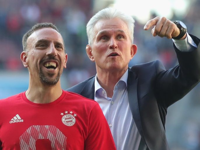AUGSBURG, GERMANY - APRIL 07: Jupp Heynckes, head coach of Bayern Muechen (r) celebrates in front of their supporters with Franck Ribery of Bayern Muenchen winning the 6th championship back to back, after the Bundesliga match between FC Augsburg and FC Bayern Muenchen at WWK-Arena on April 7, 2018 in Augsburg, Germany. (Photo by Alexander Hassenstein/Bongarts/Getty Images)