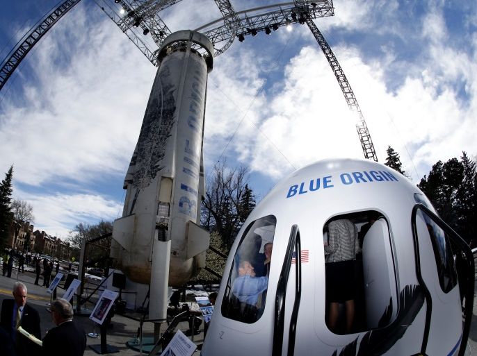 Members of the media tour the Blue Origin Crew Capsule mockup and New Shepard rocket booster at the 33rd Space Symposium in Colorado Springs, Colorado, United States April 5, 2017. REUTERS/Isaiah J. Downing