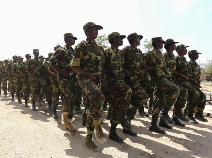 Soldiers from the Somali military march past in a parade during celebrations to mark the 54th anniversary of the Somali National Armed Forces, at Army Headquarters in the capital Mogadishu April 12, 2014. REUTERS/Feisal Omar (SOMALIA - Tags: ANNIVERSARY MILITARY)