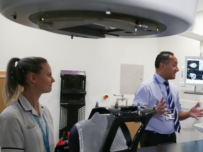 CAMBRIDGE, ENGLAND - APRIL 10: British Prime Minister Theresa May (R) is shown the advanced radiotherapy system during a visit to announce new funding and research into prostate cancer at Addenbrooke's Hospital on April 10, 2018 in Cambridge, England. (Photo by Daniel Leal-Olivas - WPA Pool/Getty Images)