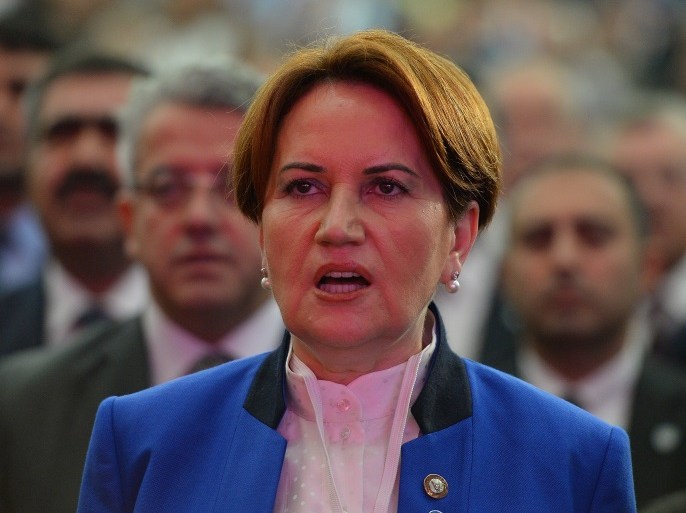 ANKARA, TURKEY - OCTOBER 25: Turkey's former interior minister and deputy parliament speaker Meral Aksener, sings the national anthem during a meeting to announce her new center right opposition party on October 25, 2017 in Ankara, Turkey. Aksener has named her party 'Iyi Parti' and their motto is 'Turkey Will Be Good.' (Photo by Mustafa Kirazli/Getty Images)