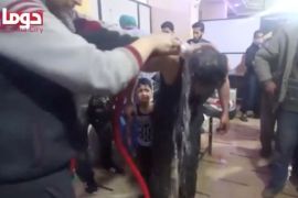 A man is washed following alleged chemical weapons attack, in what is said to be Douma, Syria in this still image from video obtained by Reuters on April 8, 2018. White Helmets/Reuters TV via REUTERS THIS IMAGE HAS BEEN SUPPLIED BY A THIRD PARTY.