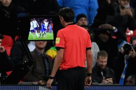 LONDON, ENGLAND - MARCH 27: Referee Deniz Aytekin checks the VAR during the International friendly between England and Italy at Wembley Stadium on March 27, 2018 in London, England. (Photo by Laurence Griffiths/Getty Images)