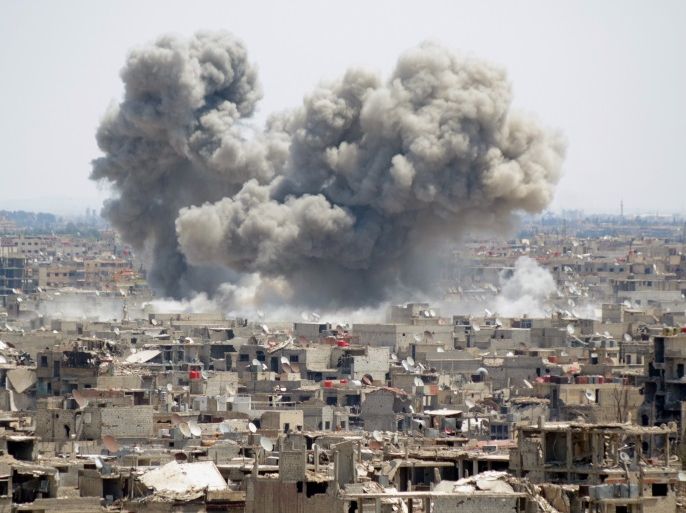 epaselect epa06688940 Smoke and dust rise from the Islamic State-held al-Hajar al-Aswad neighborhood in the south of Damascus, Syria, 24 April 2018. According to media reports, the Syrian army continued the military offensive it has started on 19 April against the IS positions in the Western Ghouta and launched intensive artillery and rocket attacks on the IS hideouts in the neighborhood and its surroundings. EPA-EFE/YOUSSEF BADAWI
