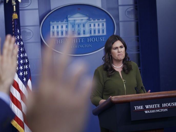 epa06650925 White House Press Secretary Sarah Huckabee Sanders responds to a question from the news media during the daily briefing at the White House in Washington, DC, USA 06 April 2018. Sanders announced a private dinner at Mt. Vernon with French President Emmanuel Macron as well as fielded questions on trade and Amazon. EPA-EFE/SHAWN THEW