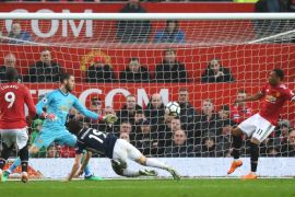 MANCHESTER, ENGLAND - APRIL 15: Jay Rodriguez of West Bromwich Albion scores his sides first goal past David De Gea of Manchester United as Anthony Martial of Manchester United attempts to block but fails during the Premier League match between Manchester United and West Bromwich Albion at Old Trafford on April 15, 2018 in Manchester, England. (Photo by Shaun Botterill/Getty Images)