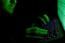 DUBAI (Reuters) - Hackers have attacked networks in a number of countries including data centers in Iran where they left the image of a U.S. flag on screens along with a warning: “Don’t mess with our elections”, the Iranian IT ministry said on Saturday. FILE PHOTO: A man types on a computer keyboard in front of the displayed cyber code in this illustration picture taken on March 1, 2017. REUTERS/Kacper Pempel/Illustration/File Photo