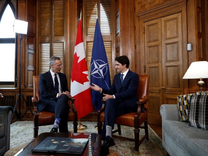 Canada's Prime Minister Justin Trudeau speaks with NATO Secretary General Jens Stoltenberg during a meeting in Trudeau's office on Parliament Hill in Ottawa, Ontario, Canada, April 4, 2018. REUTERS/Chris Wattie