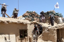 Suspected Taliban militants patrol after they reportedly took control of Ghazni's Waghaz district, in Afghanistan, 26 May 2017.