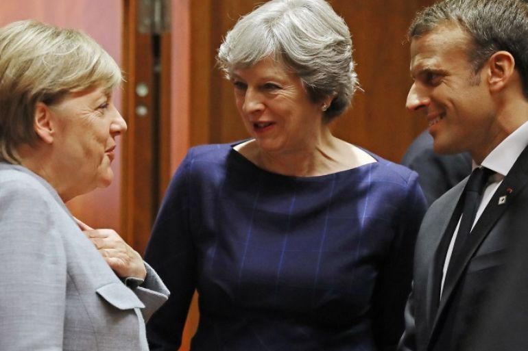 BRUSSELS, BELGIUM - OCTOBER 19: German Chancellor Angela Merkel, Britain's Prime Minister Theresa May and French President Emmanuel Macron arrive for a round table meeting on October 19, 2017 in Brussels, Belgium. Under discussion are the Iran Nuclear Deal, Brexit and North Korea. Mrs May has offered assurances to EU nationals that her government will make it as easy as possible to remain living in the United Kingdom after Brexit. (Photo by Dan Kitwood/Getty Images)