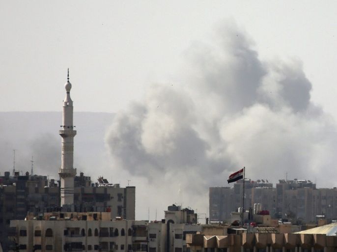 Smoke rises from Yarmouk Palestinian camp in Damascus, Syria April 20, 2018. REUTERS/Ali Hashisho