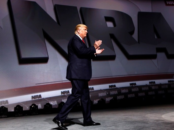 U.S. President Donald Trump arrives onstage to deliver remarks at the National Rifle Association (NRA) Leadership Forum at the Georgia World Congress Center in Atlanta, Georgia, U.S., April 28, 2017. REUTERS/Jonathan Ernst
